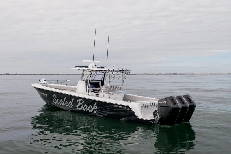  Yacht Photos Pics 2016 Contender 39 ST boat with triple Mercury engines on calm water.