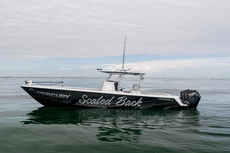  Yacht Photos Pics 2016 Contender 39 ST boat named "Scaled Back" on calm ocean waters.