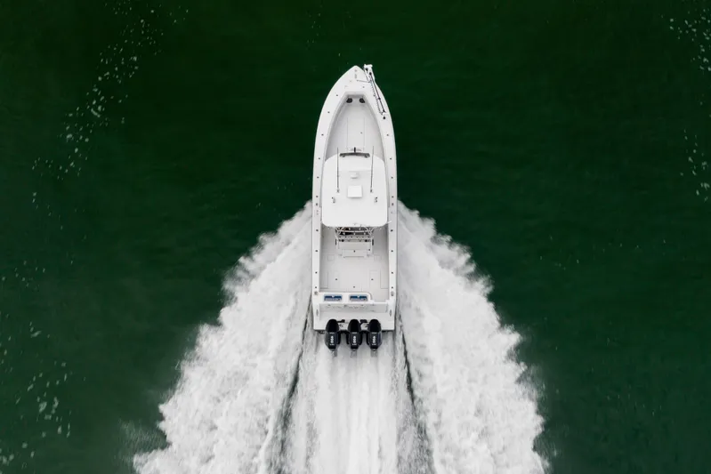  Yacht Photos Pics Aerial view of 2016 Contender 39 ST boat speeding on water.