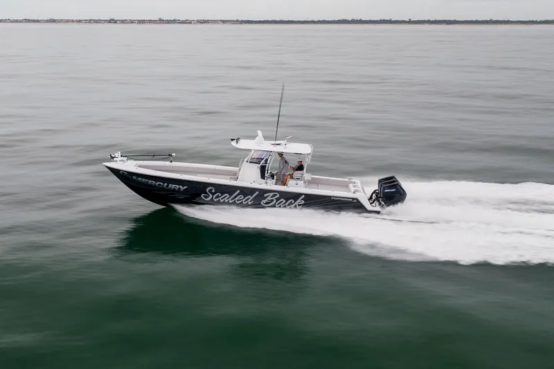  Yacht Photos Pics 2016 Contender 39 ST boat speeding on open water, side view.