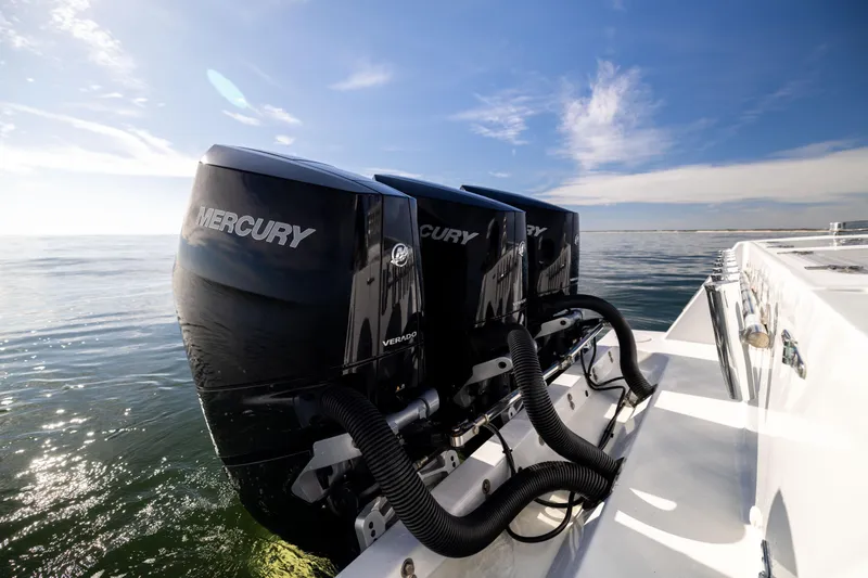  Yacht Photos Pics 2016 Contender 39 ST boat with triple Mercury Verado engines on open water.