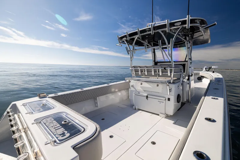  Yacht Photos Pics 2016 Contender 39 ST boat on open water under clear blue sky.