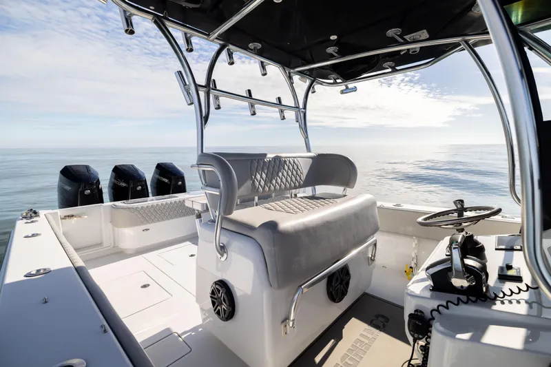  Yacht Photos Pics 2016 Contender 39 ST boat interior with helm, seating, and multiple outboard engines.