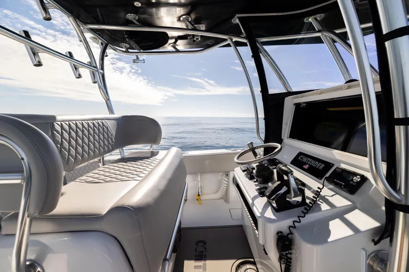  Yacht Photos Pics Interior view of 2016 Contender 39 ST boat cockpit with ocean backdrop.