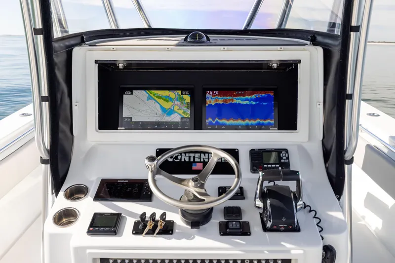  Yacht Photos Pics 2016 Contender 39 ST boat dashboard with navigation screens and controls.
