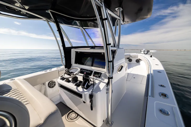  Yacht Photos Pics 2016 Contender 39 ST boat interior with steering console on calm ocean.