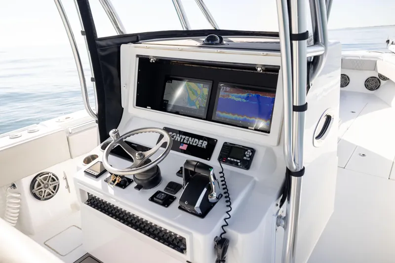  Yacht Photos Pics Helm of 2016 Contender 39 ST boat with navigation screens and controls.