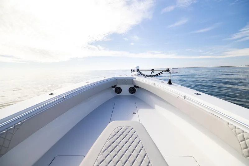  Yacht Photos Pics 2016 Contender 39 ST boat on calm ocean under clear blue sky.