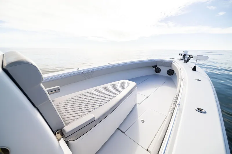  Yacht Photos Pics 2016 Contender 39 ST boat interior with cushioned seating on calm water.