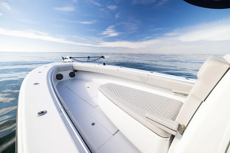  Yacht Photos Pics 2016 Contender 39 ST boat on calm ocean under clear blue sky.