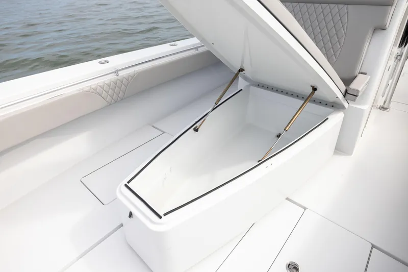  Yacht Photos Pics 2016 Contender 39 ST boat with open storage compartment on deck.