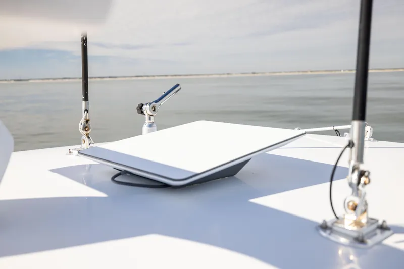  Yacht Photos Pics 2016 Contender 39 ST boat with mounted satellite dish on calm water.