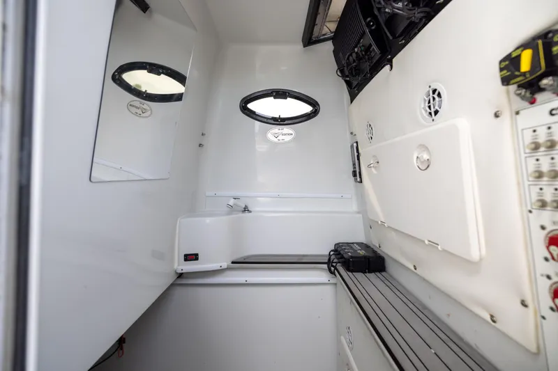  Yacht Photos Pics 2016 Contender 39 ST boat interior with control panel and porthole window.