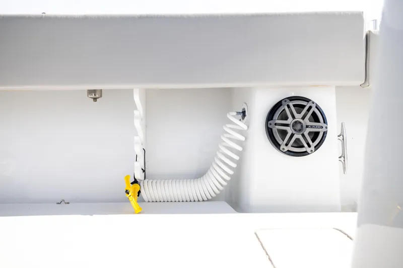  Yacht Photos Pics 2016 Contender 39 ST boat interior with coiled hose and JL Audio speaker.