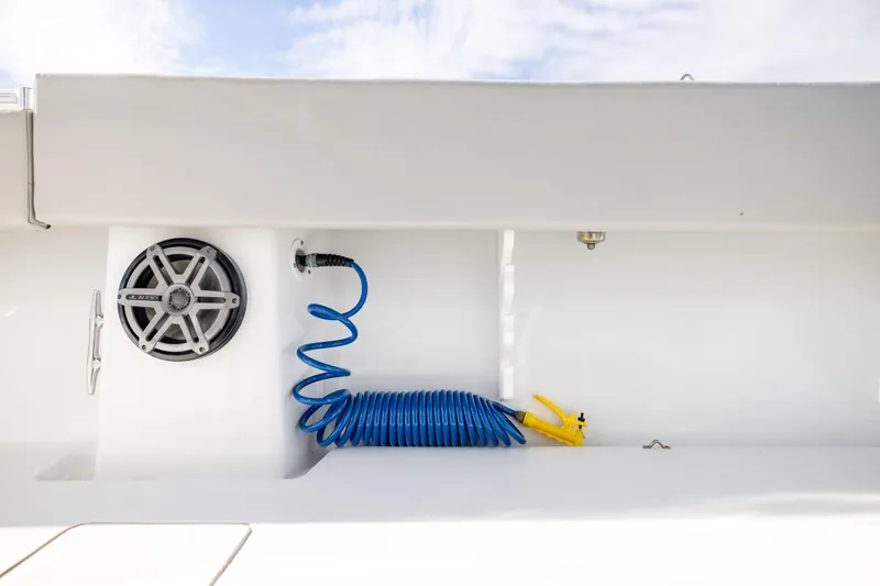  Yacht Photos Pics 2016 Contender 39 ST boat deck with speaker and coiled blue hose.