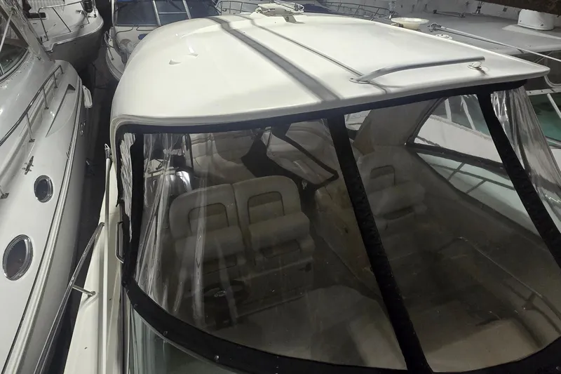 Lucky 13 Yacht Photos Pics 2009 Sea Ray Sundancer 350 yacht in storage, featuring a sleek white exterior and spacious interior.