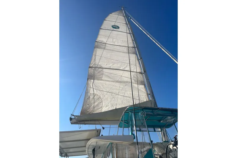 Cecil Yacht Photos Pics Sailing yacht Lagoon 39, 2014 model, with raised sails against a clear blue sky.