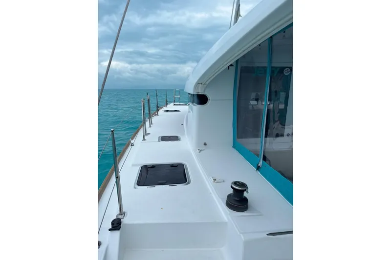 Cecil Yacht Photos Pics 2014 Lagoon 39 catamaran deck with ocean view and cloudy sky.