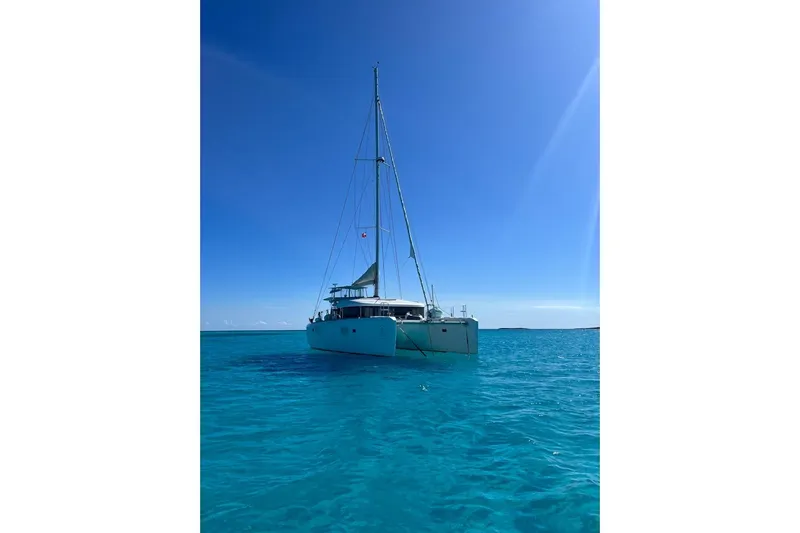 Cecil Yacht Photos Pics 2014 Lagoon 39 catamaran sailing on clear blue ocean under sunny sky.
