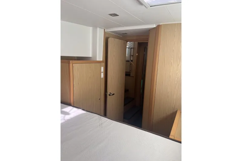 Cecil Yacht Photos Pics Interior of 2014 Lagoon 39 yacht, featuring wooden cabinetry and a cozy cabin space.