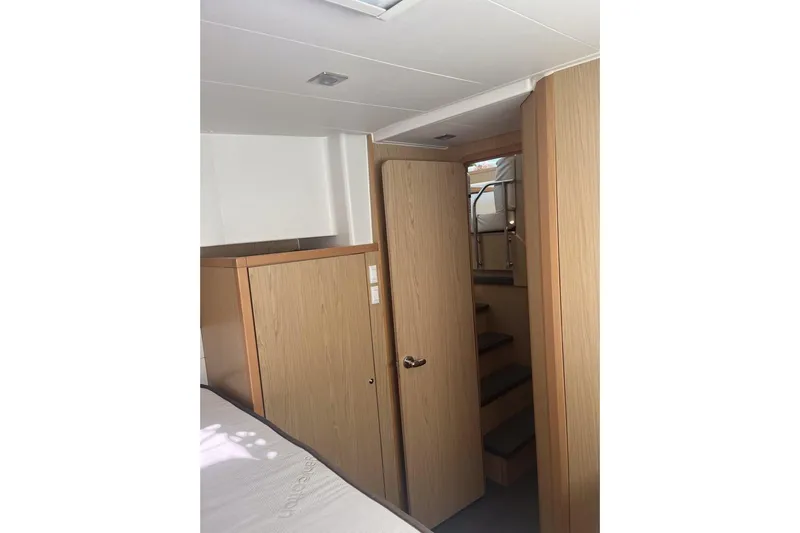 Cecil Yacht Photos Pics Interior of 2014 Lagoon 39 yacht with wooden cabinetry and stairs.