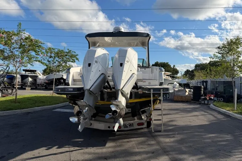  Yacht Photos Pics 2022 Aviara AV32 OB boat with dual outboard engines in a marina setting.