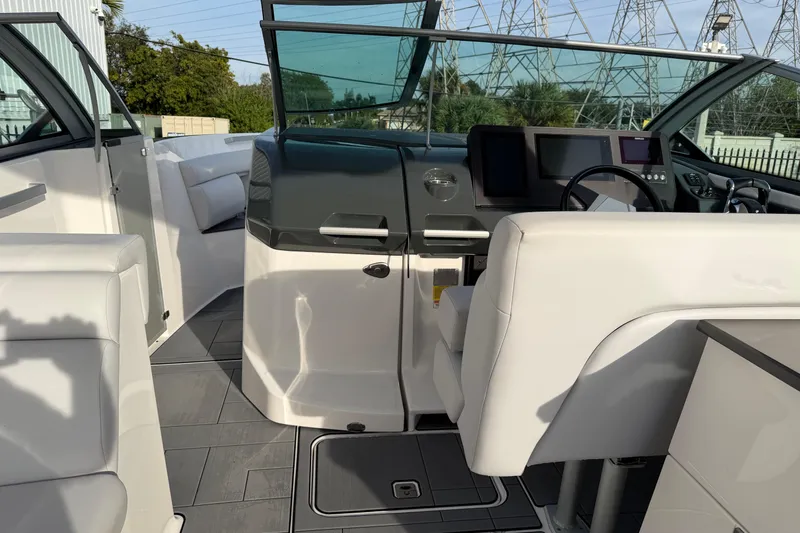  Yacht Photos Pics 2022 Aviara AV32 OB boat interior with modern helm and seating.