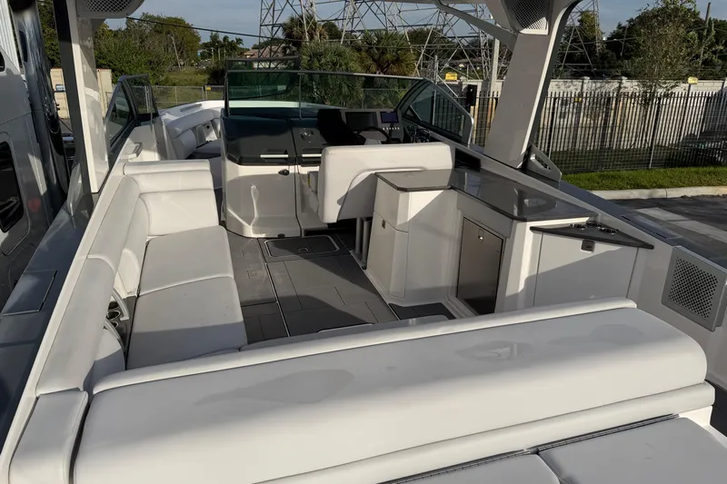  Yacht Photos Pics 2022 Aviara AV32 OB boat interior with spacious seating and modern helm.