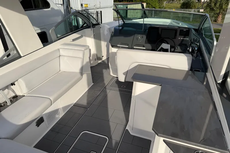  Yacht Photos Pics 2022 Aviara AV32 OB boat interior with modern seating and sleek dashboard design.