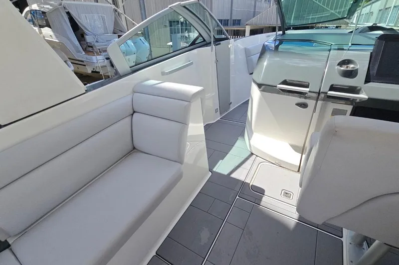  Yacht Photos Pics 2022 Aviara AV32 OB boat interior with sleek seating and modern dashboard design.