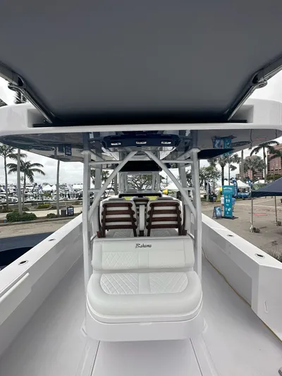 Call For Information Yacht Photos Pics 2024 Bahama 41' Open Fisherman GT boat interior with seating and console.