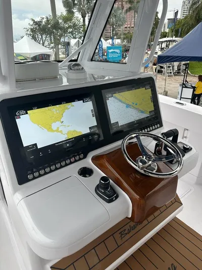 Call For Information Yacht Photos Pics Control console of 2024 Bahama 41' Open Fisherman GT with dual navigation screens.