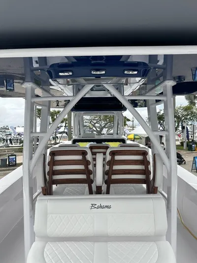 Call For Information Yacht Photos Pics 2024 Bahama 41' Open Fisherman GT interior with white seating and wooden accents.