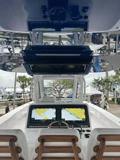 Call For Information Yacht Photos Pics 2024 Bahama 41' Open Fisherman GT helm with dual navigation screens and wooden seats.