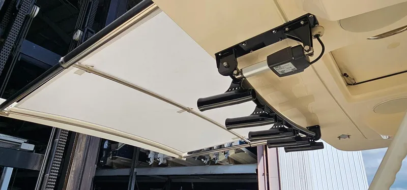  Yacht Photos Pics 2025 Scout 425 LXF boat with retractable ladder and canopy mechanism.