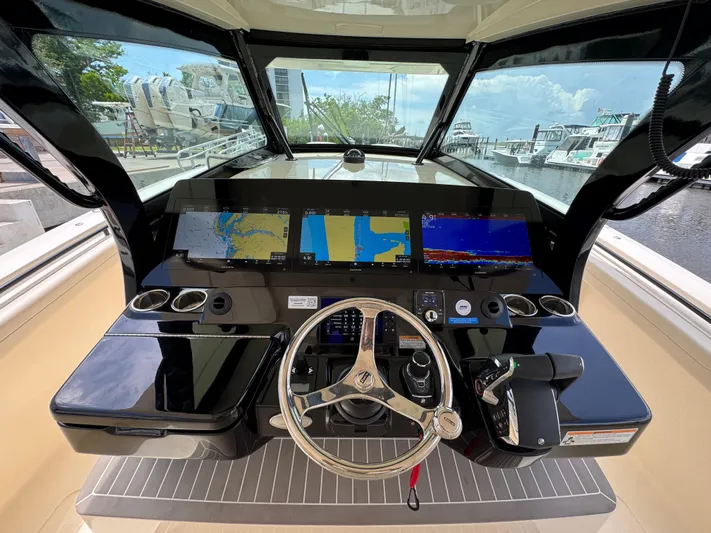  Yacht Photos Pics 2025 Scout 425 LXF boat dashboard with advanced navigation displays and controls.