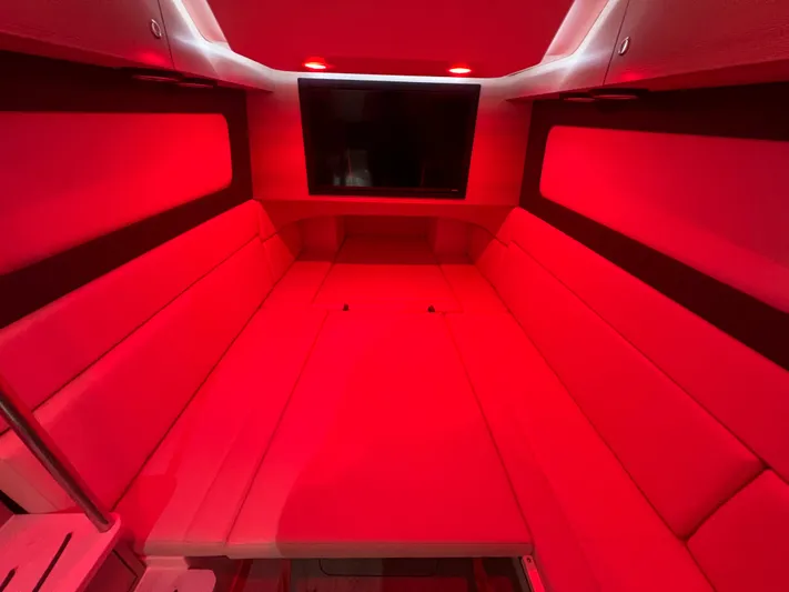 Yacht Photos Pics Luxurious red-lit interior cabin of 2025 Scout 425 LXF boat.