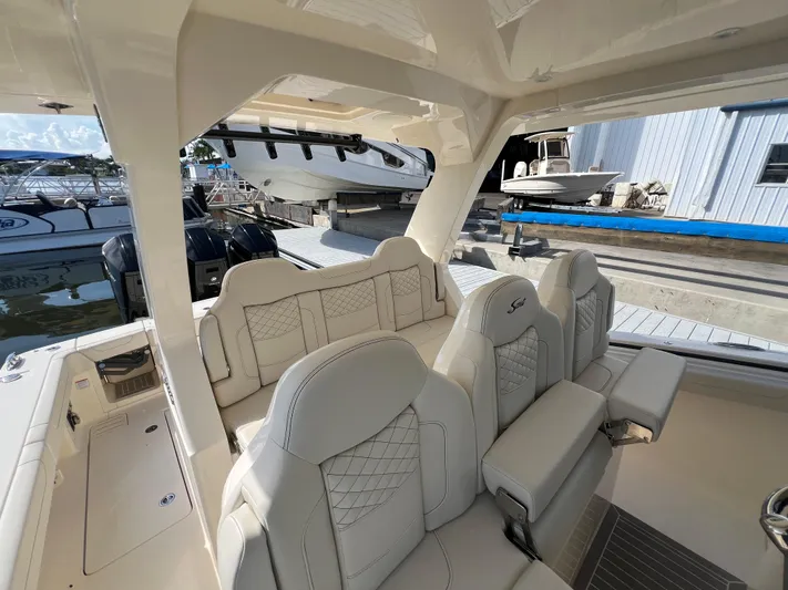 Yacht Photos Pics Luxurious seating on 2025 Scout 425 LXF boat at marina dock.