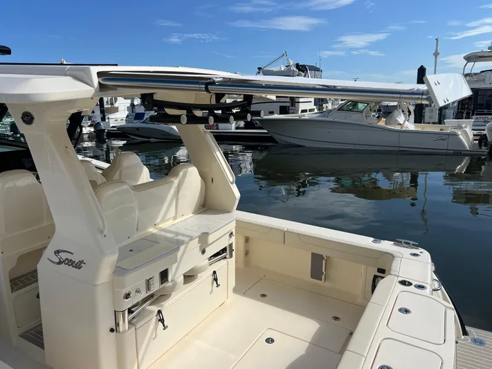  Yacht Photos Pics 2025 Scout 425 LXF boat docked at marina, showcasing sleek design and luxury features.