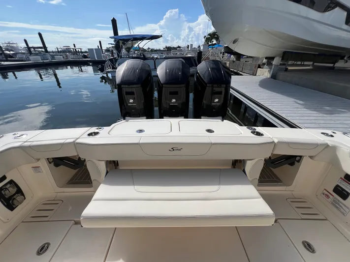  Yacht Photos Pics 2025 Scout 425 LXF boat with triple outboard engines docked at marina.