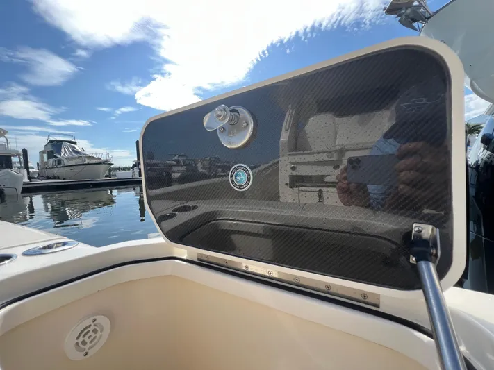  Yacht Photos Pics 2025 Scout 425 LXF boat detail with carbon fiber panel at marina.