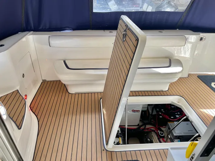 Covetime II Yacht Photos Pics Interior of a 2006 Sea Ray 44 Sedan Bridge with open floor hatch.