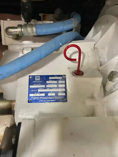 Covetime II Yacht Photos Pics Engine compartment of 2006 Sea Ray 44 Sedan Bridge with blue hoses.