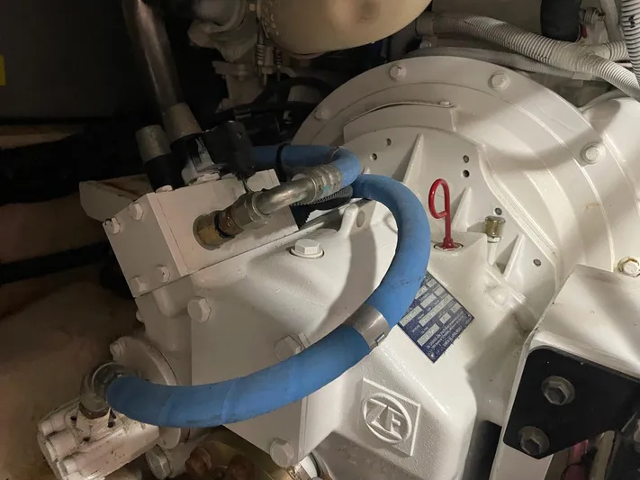 Covetime II Yacht Photos Pics Engine compartment of 2006 Sea Ray 44 Sedan Bridge with blue hose.