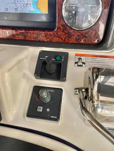 Covetime II Yacht Photos Pics Control panel of 2006 Sea Ray 44 Sedan Bridge with joystick and instruments.