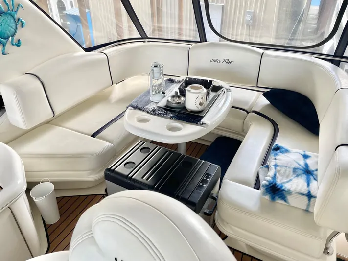 Covetime II Yacht Photos Pics Interior of a 2006 Sea Ray 44 Sedan Bridge with white leather seating.