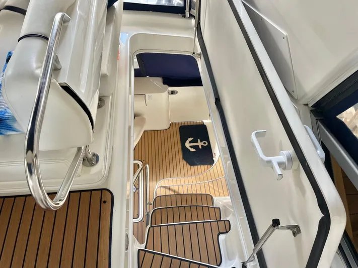 Covetime II Yacht Photos Pics Interior of 2006 Sea Ray 44 Sedan Bridge with wooden flooring.
