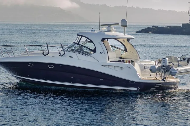 Hideout Yacht Photos Pics 2005 Sea Ray 390 Sundancer yacht cruising on calm waters.