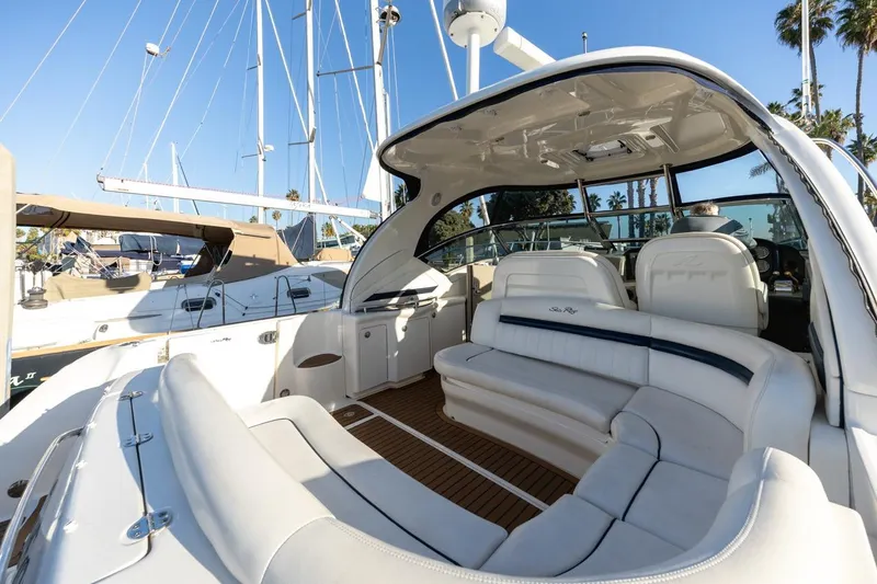 Hideout Yacht Photos Pics 2005 Sea Ray 390 Sundancer yacht with luxurious white seating and sleek design.