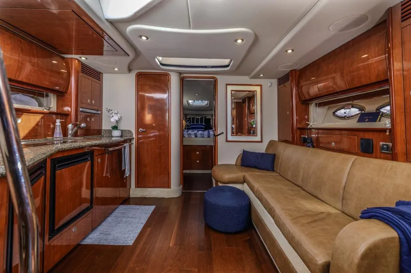 Hideout Yacht Photos Pics Luxurious interior of 2005 Sea Ray 390 Sundancer yacht with elegant wood finishes.